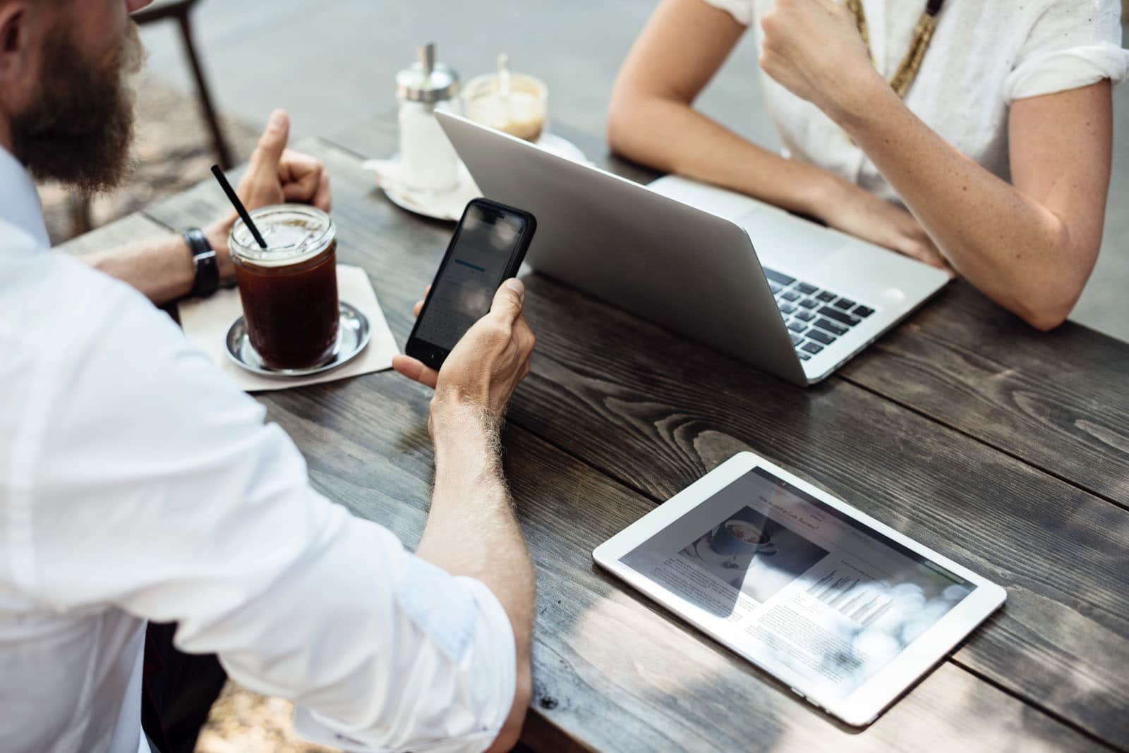 a man sitting at a table with a laptop
