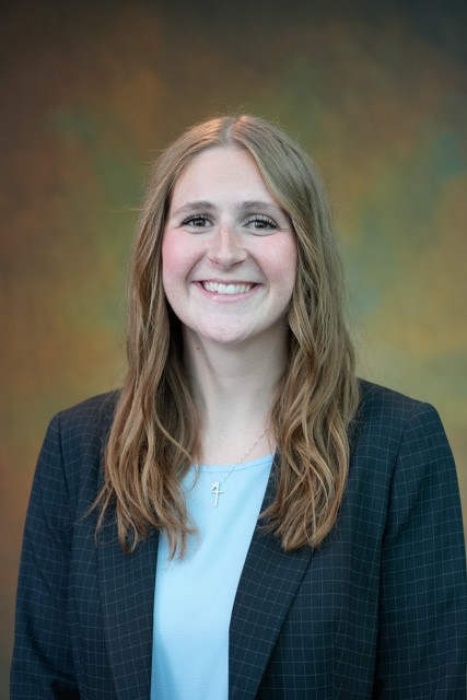 a person smiling for the camera a person smiling for the camera